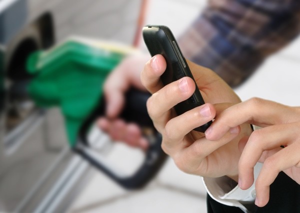 Using a mobile at petrol station