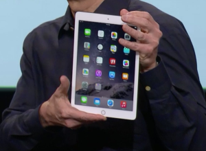 Apple's Tim Cook holds the new iPad Air 2